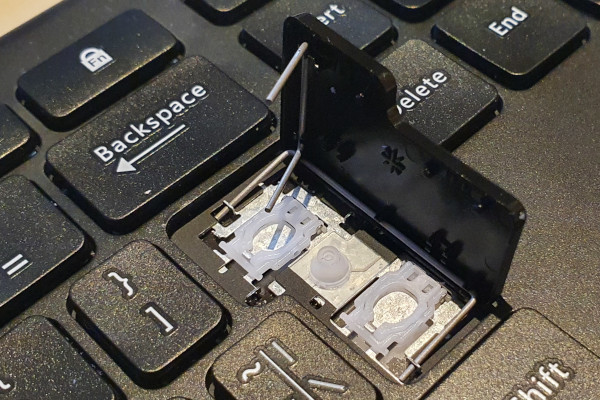 Key spring mechanism